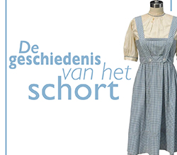 het lichtblauw geruite schort van Dorothy uit the Wizard of Oz met de tekst geschiedenis van het schort als uitgelichte afbeelding